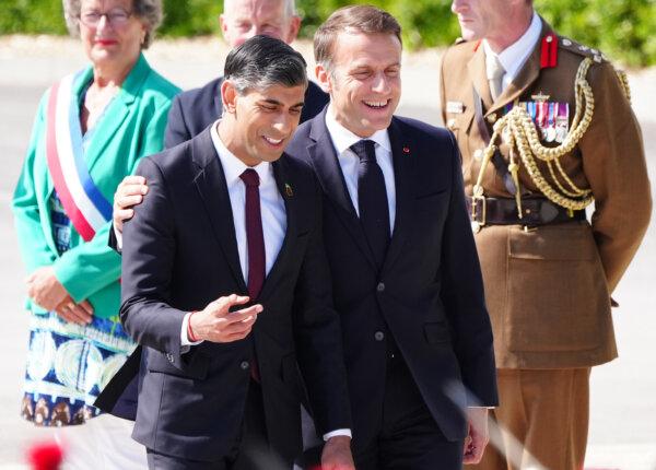 French President Emmanuel Macron (R) with Prime Minister Rishi Sunak (L) at the UK national commemorative event for the 80th anniversary of D-Day, held at the British Normandy Memorial in Ver-sur-Mer, Normandy, France, on June 6, 2024. (Jane Barlow/PA)