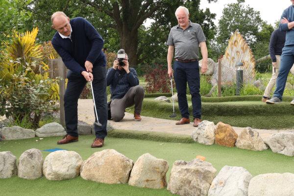Liberal Democrat leader Sir Ed Davey (L) playing crazy golf at Wokingham Family Golf in Wokingham, England on June 8, 2024. (Will Durrant/PA Wire)