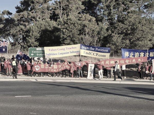 Human rights demonstrators and pro-CCP protestors are seen holding banners and flags in Canberra, Australia, on June 16, 2024. (Luo Ya/The Epoch Times)