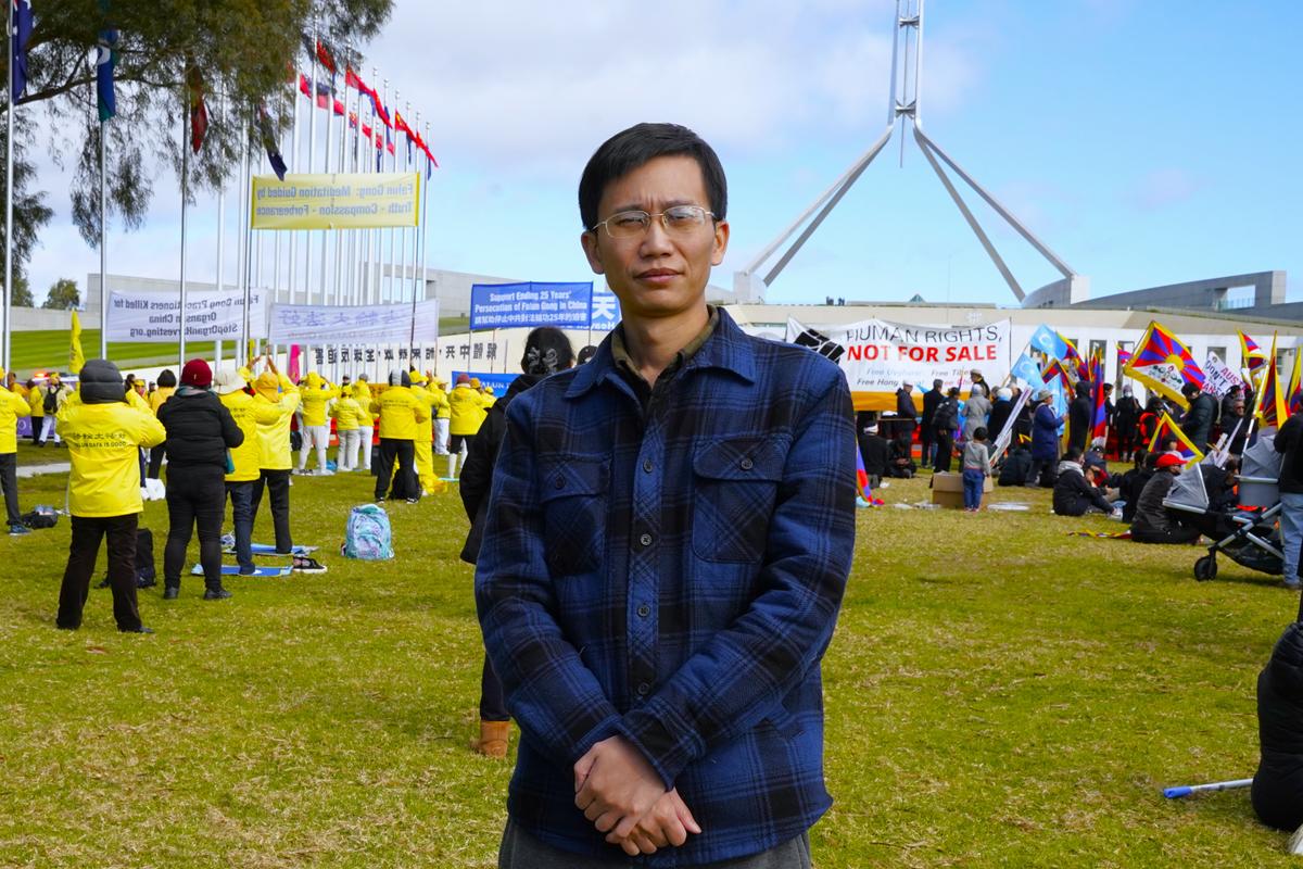 Chinese defector and former spy "Eric" attends a rally in response to the official visit of CCP Premier Li Qiang in Canberra, Australia, on June 17, 2024. (The Epoch Times)