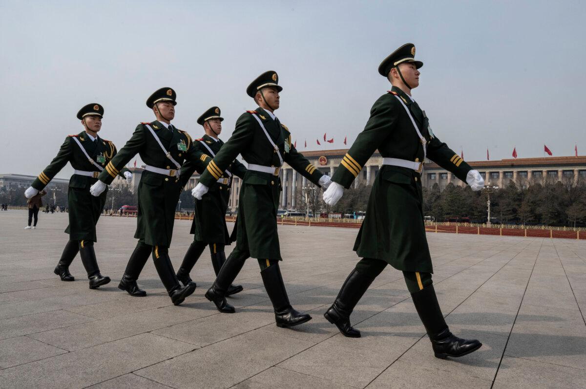 Members of a People's Liberation Army honor guard march in Tiananmen Square after the closing session of the Chinese People's Political Consultative Conference at the Great Hall of the People in Beijing on March 10, 2024. (Kevin Frayer/Getty Images)