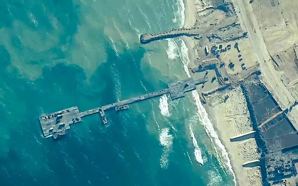 U.S. Army soldiers assigned to the 7th Transportation Brigade (Expeditionary), U.S. Navy sailors assigned to Amphibious Construction Battalion 1, and Israel Defense Forces place the Trident Pier on the coast of the Gaza Strip on May 16, 2024. (U.S. Central Command via AP)