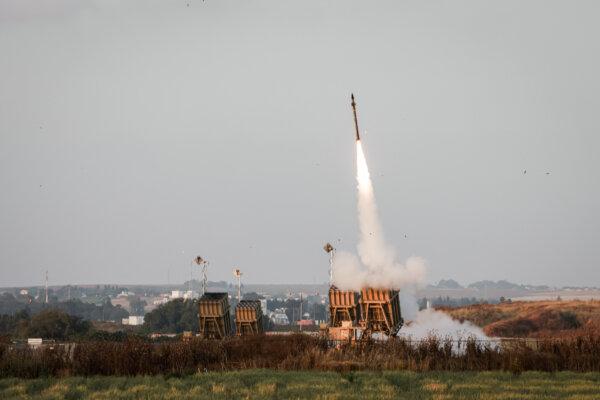 Israeli military forces fire rockets from the Iron Dome defense system to intercept rockets launched from the Gaza Strip, near Sderot, Israel, on May 13, 2023. (Menahem Kahana/AFP via Getty Images)