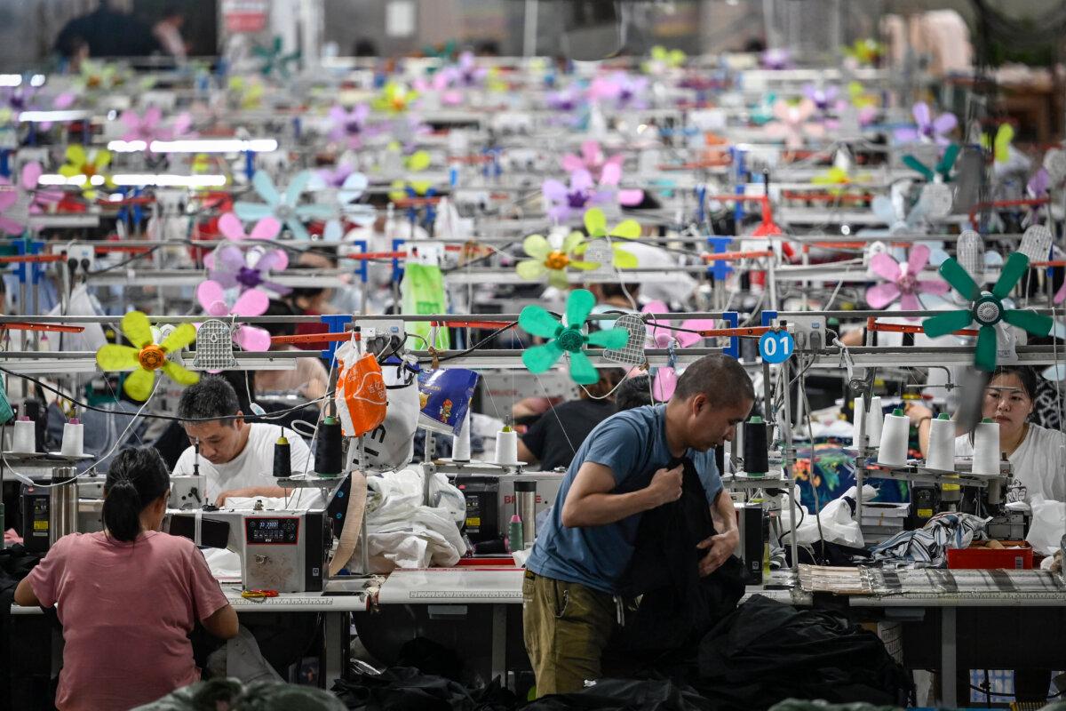 Workers producing garments at a textile factory that supplies clothes to fast fashion e-commerce company Shein in Guangzhou, Guangdong Province, China, on June 11, 2024. (Jade Gao/ AFP via Getty Images)