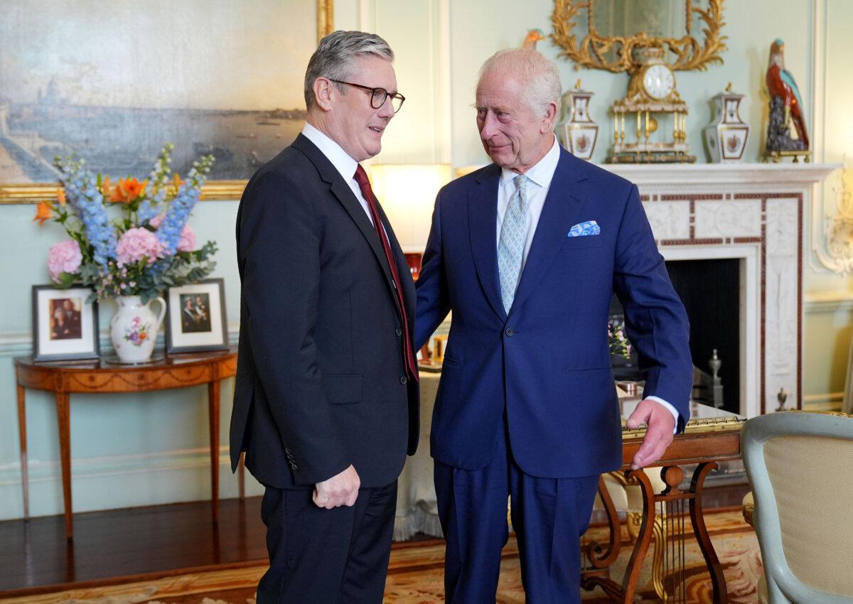 King Charles III speaks with the new prime minister, Sir Keir Starmer, during an audience at Buckingham Palace, London, on July 5, 2024. (Yui Mok/PA Wire)