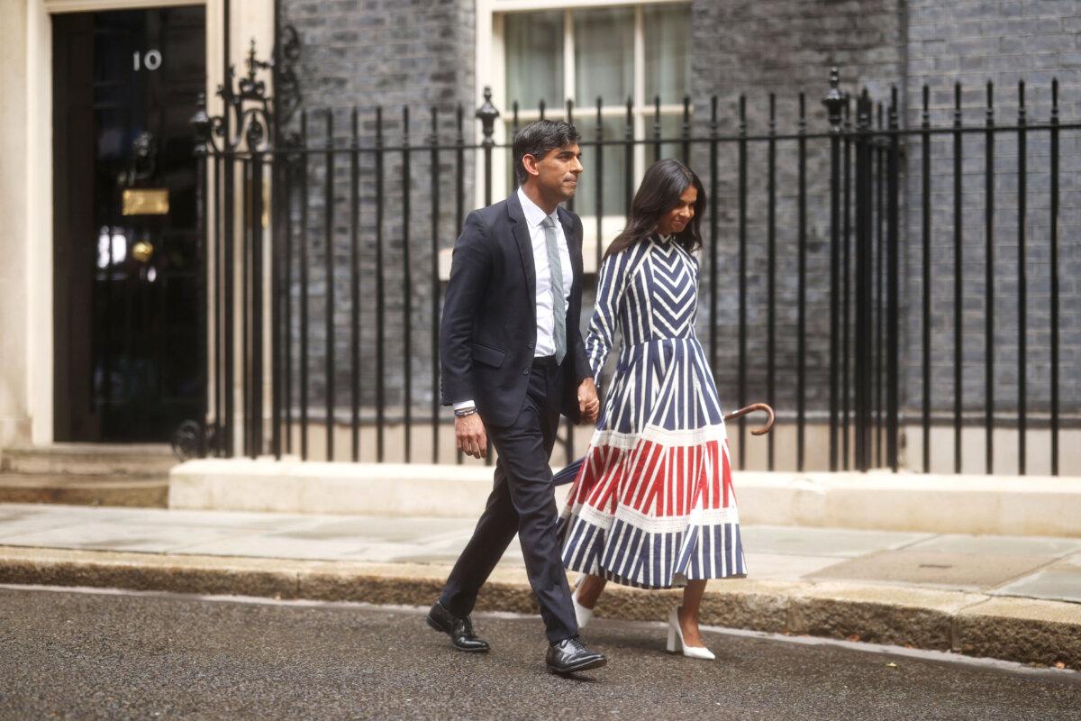 Outgoing Conservative Prime Minister Rishi Sunak and wife Akshata Murty leave 10 Downing Street following Labour's landslide election victory in London on July 5, 2024. (Dan Kitwood/Getty Images)