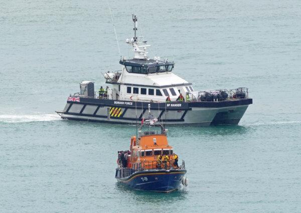 An RNLI Lifeboat and a Border Force vessel with groups of people thought to be migrants onboard, wait to unload in Dover, Kent, on July 9, 2024. (Gareth Fuller/PA Wire)