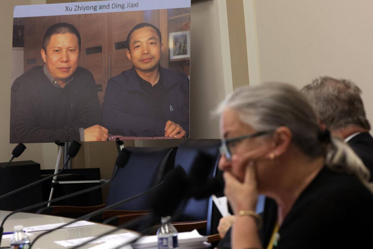 A photograph of Chinese civil rights activist Xu Zhiyong and Chinese human rights lawyer Ding Jiaxi is on display during a hearing on Capitol Hill on April 20, 2023. (Alex Wong/Getty Images)