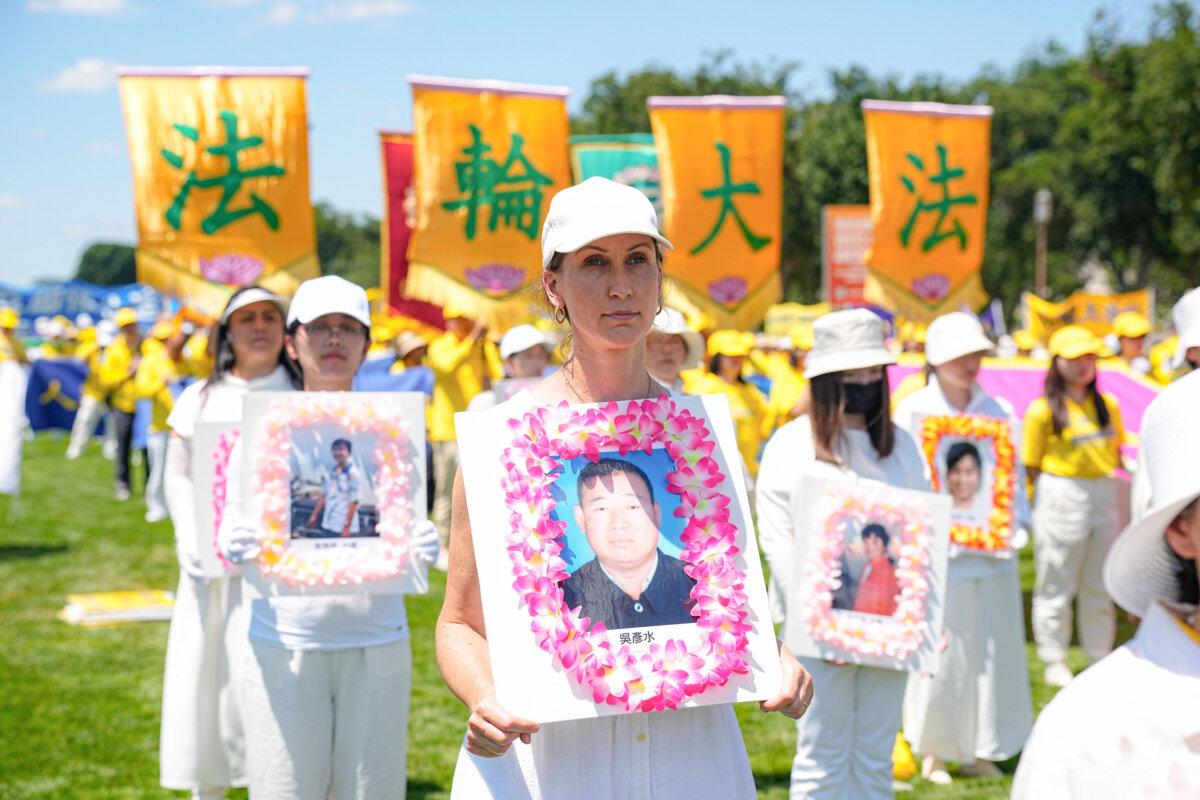 Falun Gong practitioners call for an end to the Chinese Communist Party’s 25-year-long persecution of the spiritual practice at a rally at the National Mall in Washington on July 11, 2024. (Larry Dye/The Epoch Times)