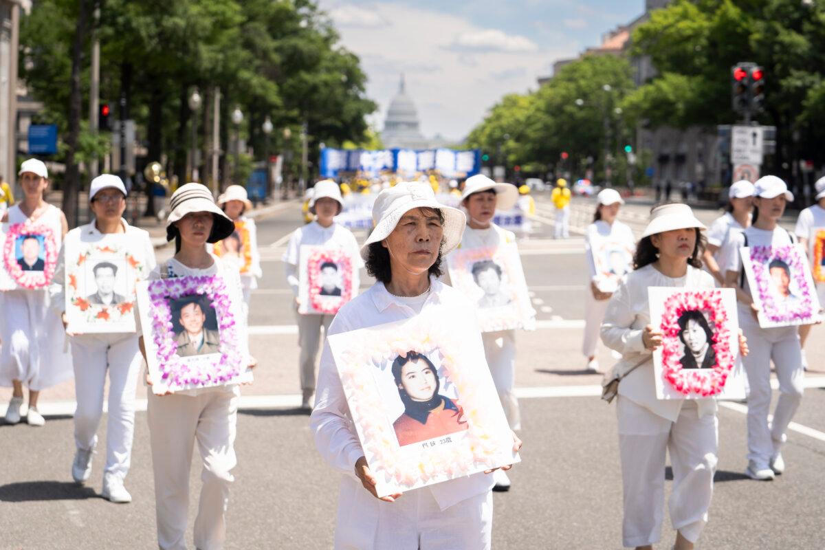 Falun Gong practitioners march during a parade calling for an end to the Chinese Communist Party’s 25-year-long persecution of the spiritual practice in Washington on July 11, 2024. (Madalina Vasiliu/The Epoch Times)