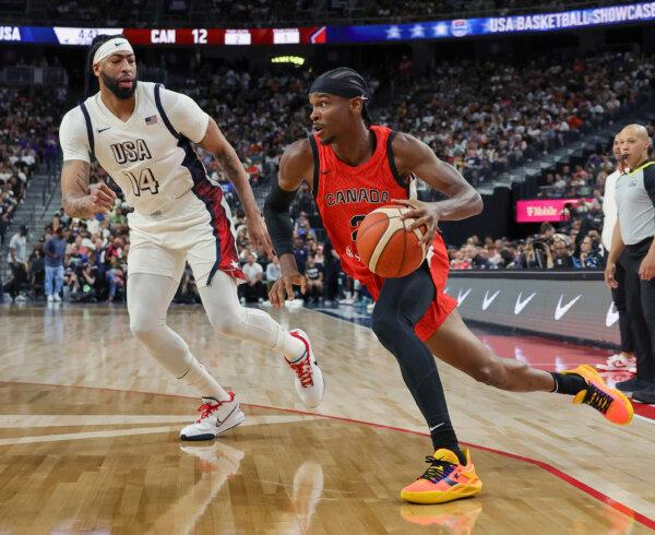 Shai Gilgeous-Alexander #2, the star player of the Canadian team, drives against Anthony Davis #14 of the United States in the first half of their exhibition game ahead of the Paris Olympic Games at T-Mobile Arena in Las Vegas, Nevada., on July 10, 2024. (Ethan Miller/Getty Images)