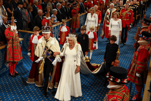 King Charles III, wearing the Imperial State Crown and the Robe of State, and Queen Camilla, wearing the George IV State Diadem, leave after the State Opening of Parliament, in the House of Lords at the Palace of Westminster in London on July 17, 2024. (Hannah McKay/PA Wire)