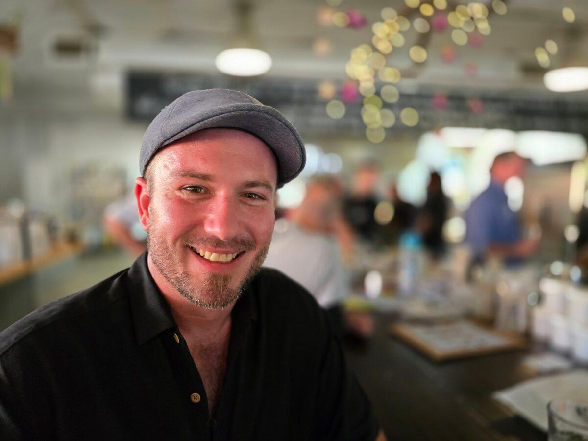 Unvaccinated single Bradley Ahlgren said he hoped to meet like-minded people during a social gather of the unvaccinated in Phoenix, Ariz., on July 15, 2024. (Allan Stein/The Epoch Times)