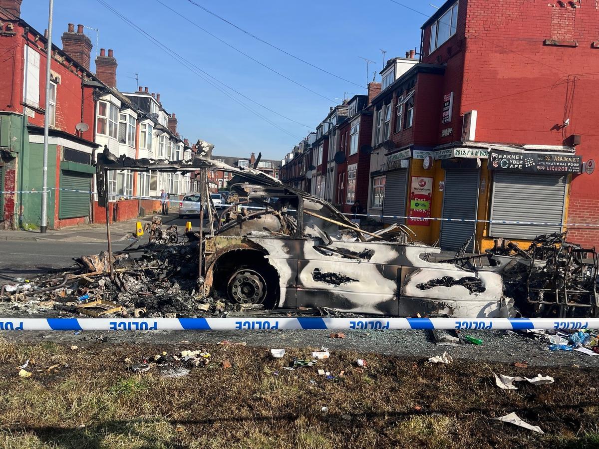 Leeds Rioters Overturn Police Car and Set Vehicles on Fire