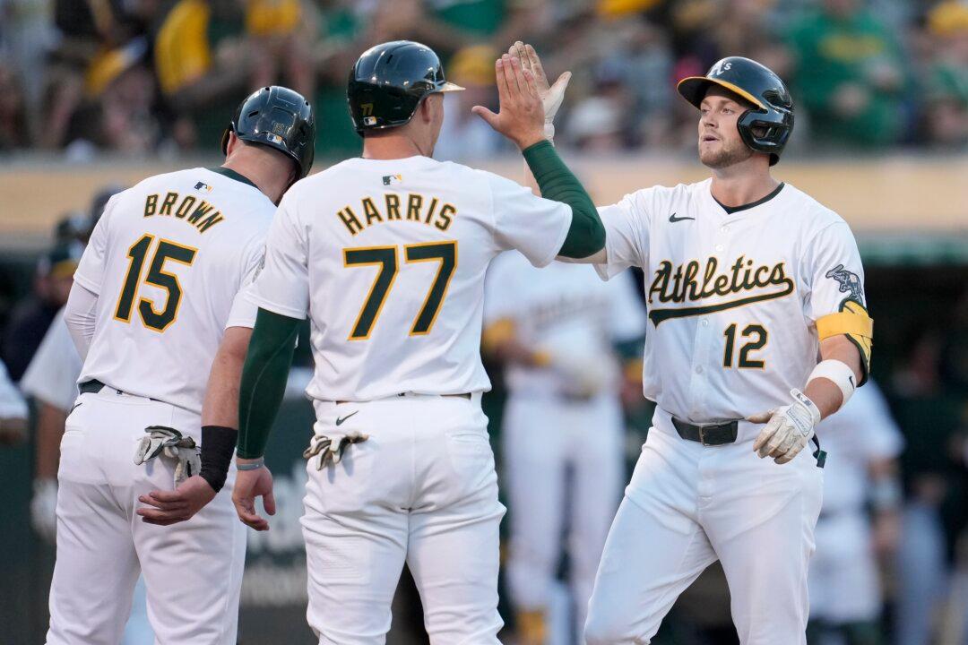Schuemann Homers, Drives in 4 and Athletics Beat Angels 13–3
