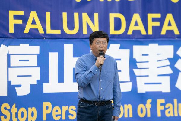 Yingnian Wu, a professor at the University of California–Los Angeles, speaks at an event to mark 25 years of the Chinese Communist Party's persecution of Falun Gong in China, in front of the Chinese Consulate in Los Angeles on July 20, 2024. (Alex Lee/The Epoch Times)