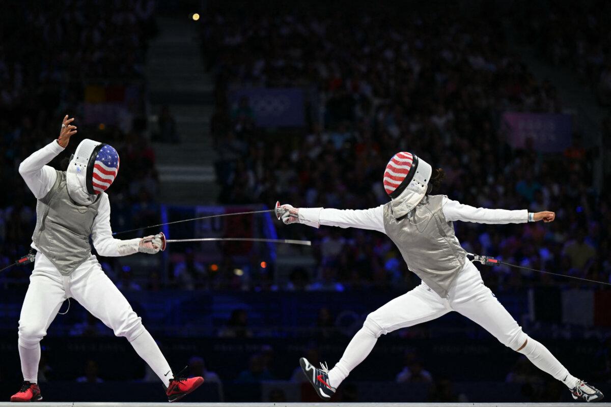 Lauren Scruggs (L) and Lee Kiefer compete in the women's foil individual gold medal bout during the Paris 2024 Olympic Games at the Grand Palais in Paris on July 28, 2024. (Fabrice Coffrini/AFP via Getty Images)
