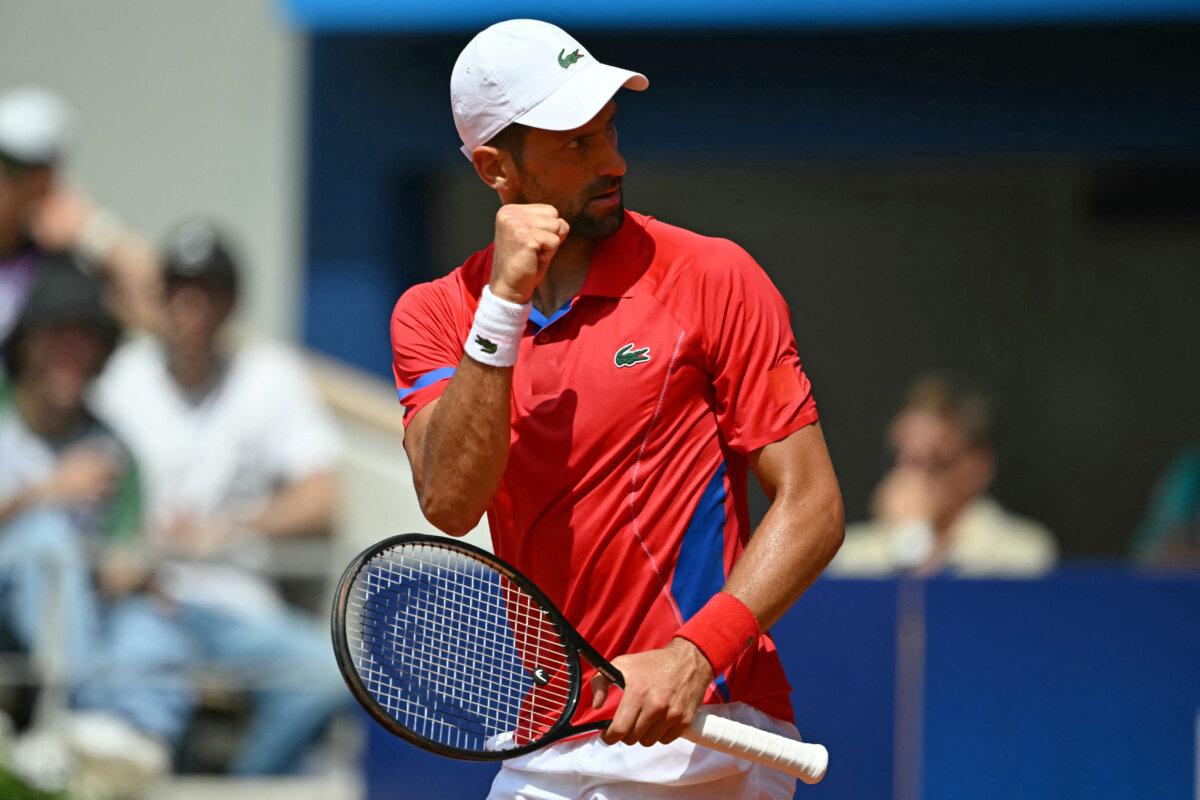 Serbia's Novak Djokovic reacts while playing against Germany's Dominik Koepfer during their men's singles third round tennis match on Court Philippe-Chatrier at the Roland-Garros Stadium during the Paris 2024 Olympic Games, in Paris on July 31, 2024. (Carl De Souza/AFP via Getty Images)
