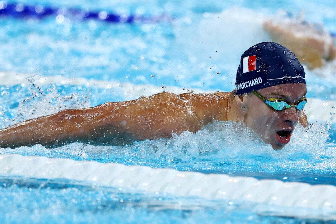 Marchand Takes 200 Butterfly Gold in Olympic Record Time