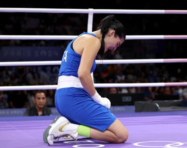 Angela Carini of Team Italy reacts after abandoning her women's 66 kg preliminary round match against Imane Khelif of Team Algeria in the first round on day six of the Olympic Games Paris 2024 at North Paris Arena in Paris on Aug. 1, 2024. (Richard Pelham/Getty Images)
