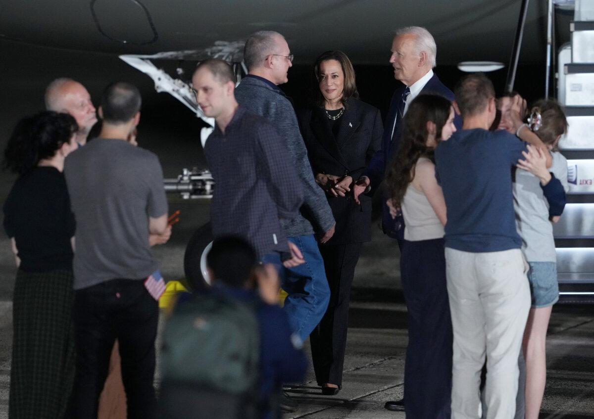 President Joe Biden and Vice President Kamala Harris welcome Paul Whelan, Evan Gershkovich, and Alsu Kurmasheva, all prisoners freed by Russia, as they arrive at Joint Base Andrews, Md., on Aug. 1, 2024. (Andrew Harnik/Getty Images)