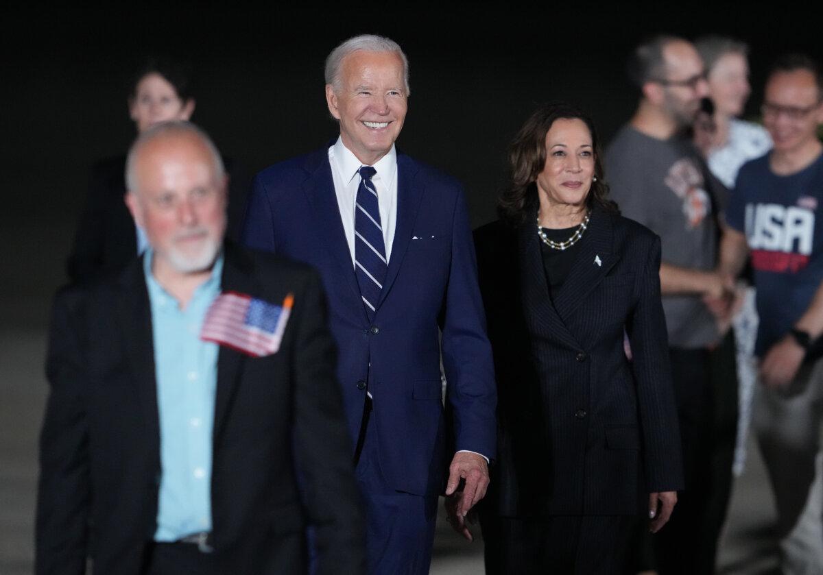 President Joe Biden and Vice President Kamala Harris walk on the tarmac after welcoming home freed prisoners Paul Whelan, Evan Gershkovich and Alsu Kurmasheva after they arrived at Joint Base Andrews, Md., on Aug. 1, 2024. (Andrew Harnik/Getty Images)