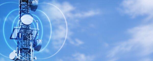 "Antenna tower as phone base station with radio waves on sky background, illustration concept with copy space for wireless communication for tv, internet and mobile communication." (Photo Contributor: winyuu)