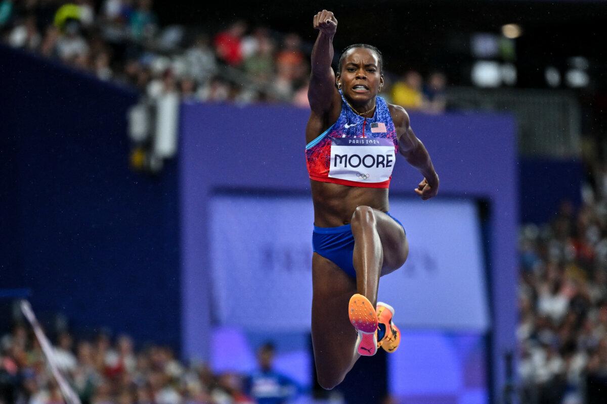 US' Jasmine Moore competes in the women's triple jump final of the athletics event at the Paris 2024 Olympic Games at Stade de France in Saint-Denis, north of Paris, on August 3, 2024. (Andrej Isakovic/AFP via Getty Images)