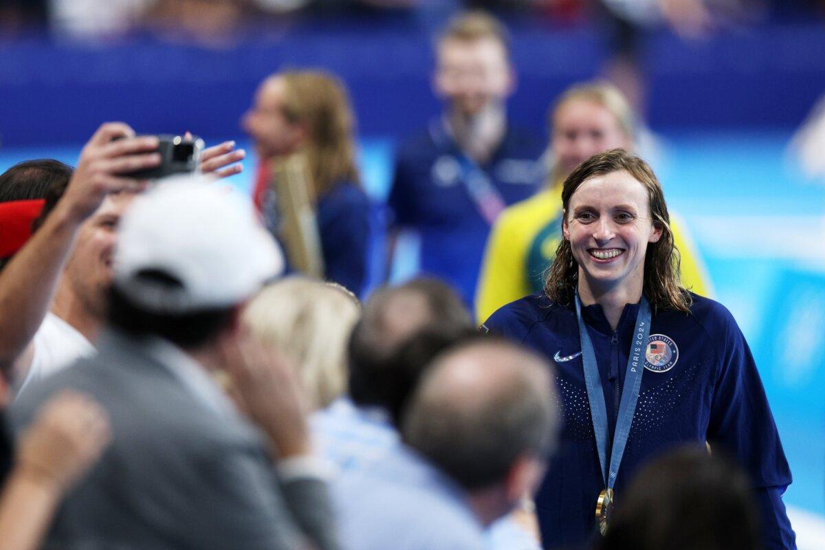 Gold medallist US' Katie Ledecky celebrates during the podium ceremony of the women's 800m freestyle swimming event during the Paris 2024 Olympic Games at the Paris La Defense Arena in Nanterre, west of Paris, on August 3, 2024. (Jonathan Nackstrand/AFP via Getty Images)