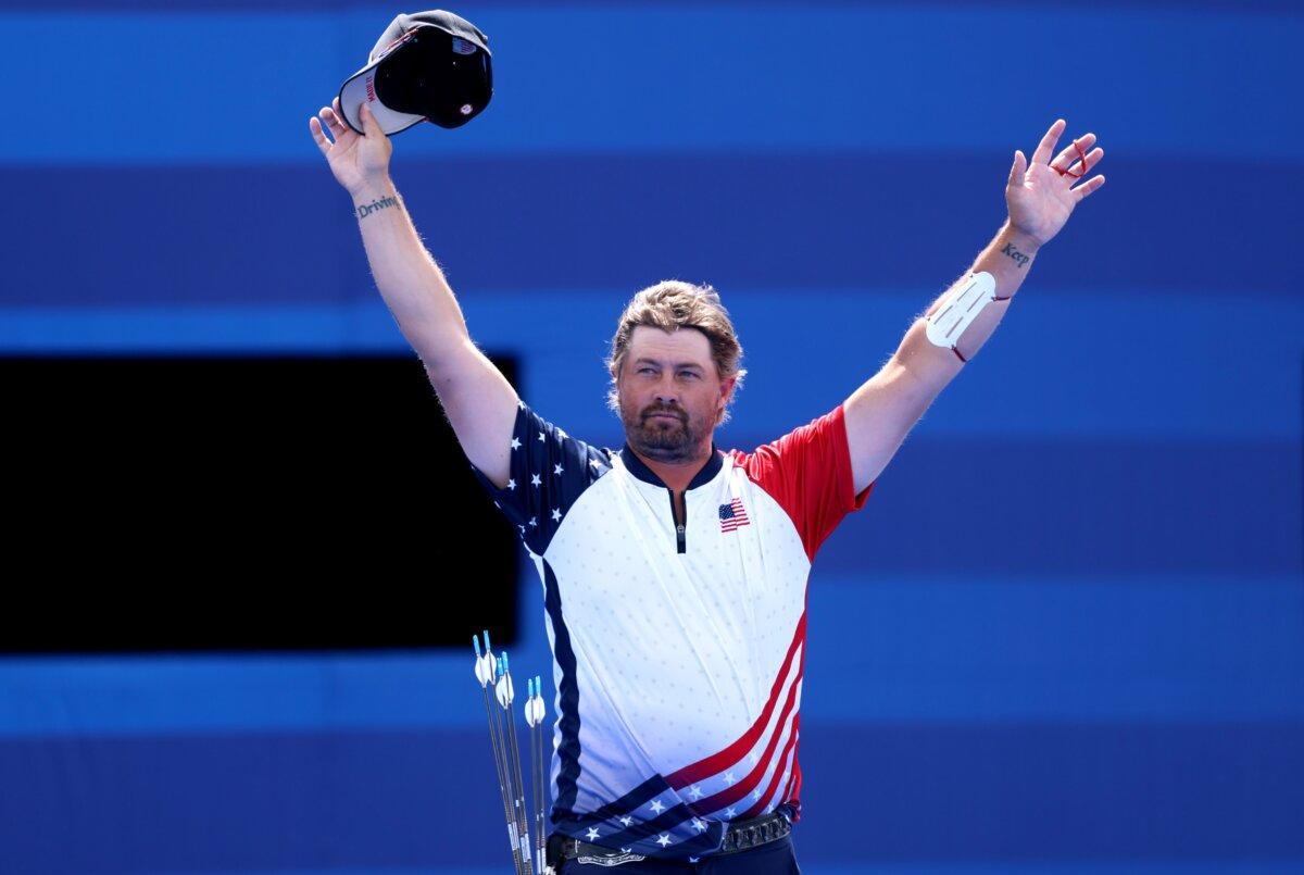 Silver medallist Brady Ellison of Team United States acknowledges the fans on the podium after the Men’s Individual Archery competition on day nine of the Olympic Games Paris 2024 at Esplanade Des Invalides in Paris on August 4, 2024. (Alex Pantling/Getty Images)