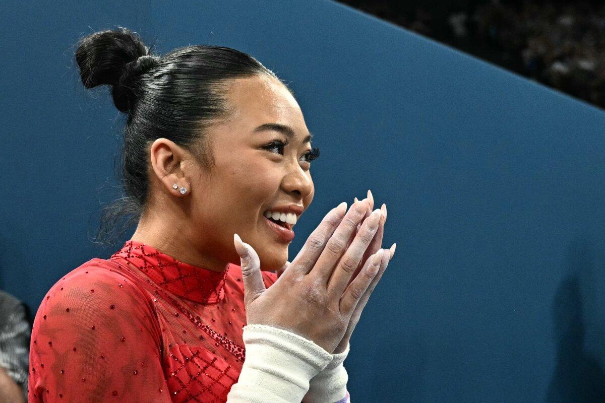 Suni Lee of Team United States celebrates winning the bronze medal at the end of competes in the artistic gymnastics women's uneven bars final during the Paris 2024 Olympic Games at the Bercy Arena in Paris, on August 4, 2024. (Lionel Bonaventure/AFP via Getty Images)