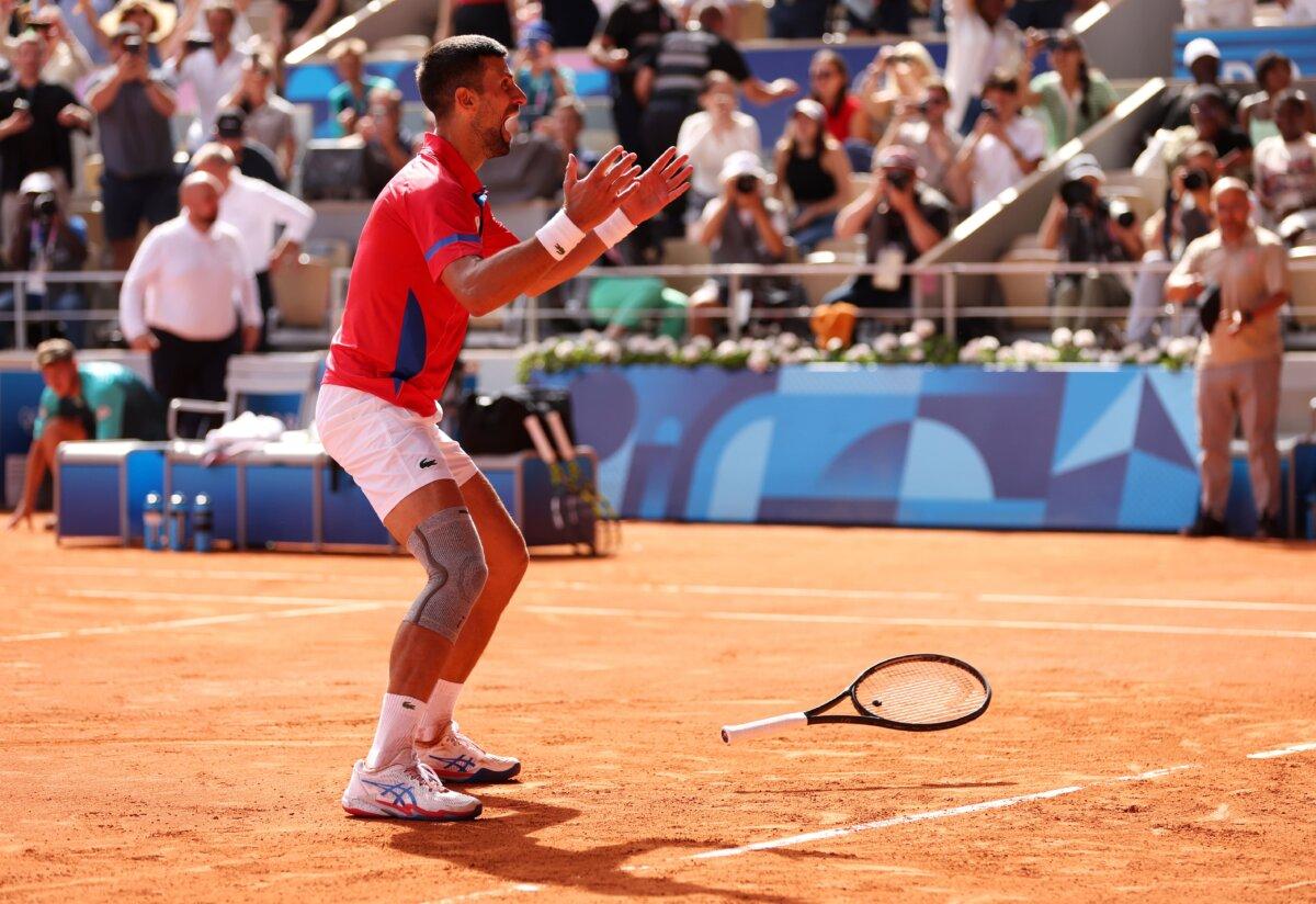 Novak Djokovic of Team Serbia celebrates match point during the Men's Singles Gold medal match against Carlos Alcaraz of Team Spain on day nine of the Olympic Games Paris 2024 at Roland Garros in Paris on August 4, 2024. (Clive Brunskill/Getty Images)
