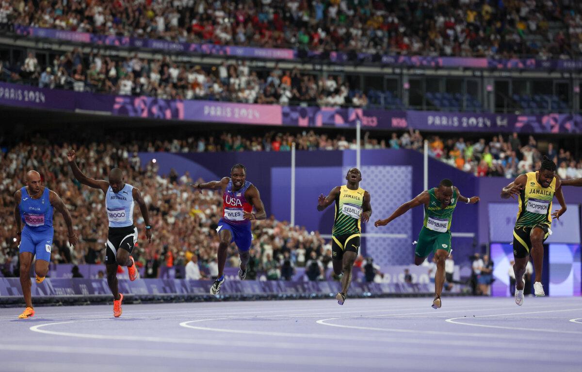 Noah Lyles of the United States crosses the finish line during the Men's 100m Final on day nine of the Olympic Games Paris 2024 at Stade de France in Paris on August 4, 2024. (Hannah Peters/Getty Images)