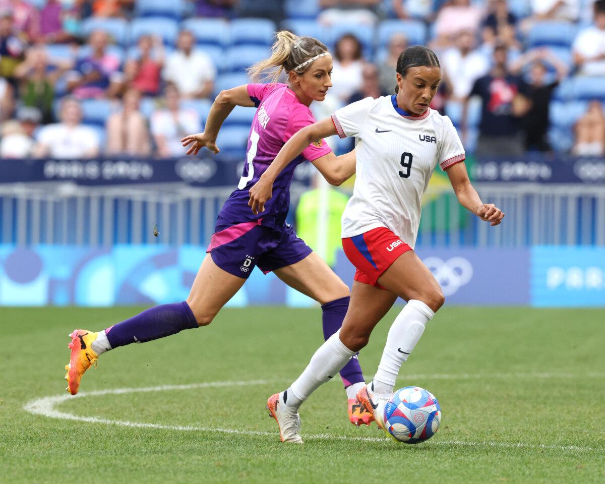 Mallory Swanson of Team United States controls the ball against Kathrin Hendrich of Team Germany during the Women's semifinal match between USA and Germany in Lyon, France, on Aug. 6, 2024. (Claudio Villa/Getty Images)