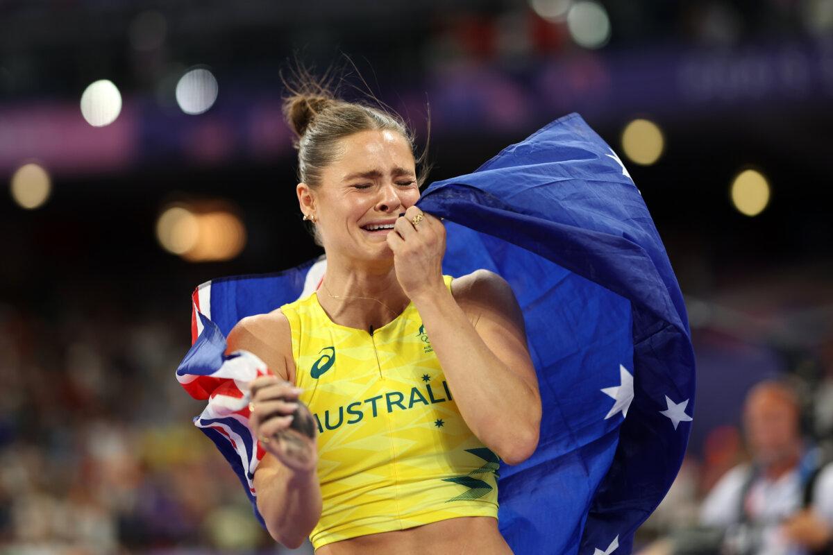 Gold medalist Nina Kennedy of Team Australia reacts after winning in the women's pole vault final on day 12 of the Olympic Games at Stade de France in Paris on Aug. 7, 2024. (Cameron Spencer/Getty Images)
