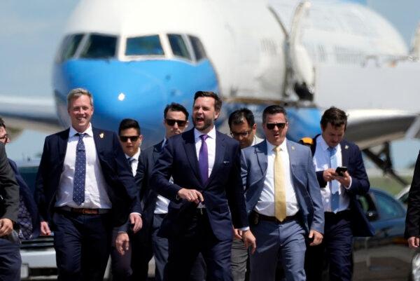 Republican vice presidential nominee and Sen. JD Vance (R-Ohio) walks back from looking at Air Force Two at Chippewa Valley Regional Airport in Eau Claire, Wis., on Aug. 7, 2024. (AP Photo/Alex Brandon)