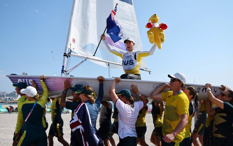Gold medalist Matt Wearn of Australia celebrates after winning the men's dinghy medal race during the Paris Olympic Games Marseille Marina, France, on Aug. 7, 2024. (Luisa Gonzalez/Reuters)