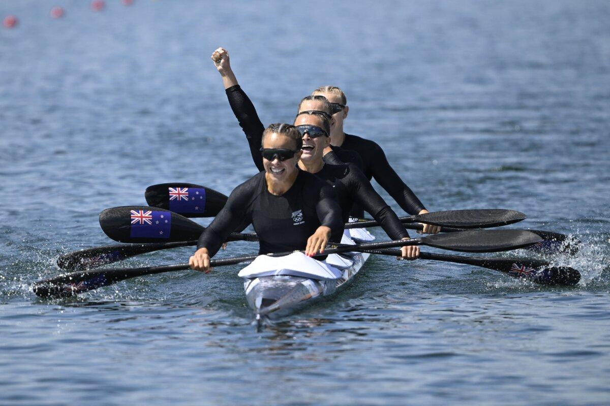 Lisa Carrington, Alicia Hoskin, Olivia Brett, and Tara Vaughan of Team New Zealand celebrate winning the gold medal following the women's kayak four 500m finals on day 13 of the Olympic Games at Vaires-Sur-Marne Nautical Stadium in Paris on Aug. 8, 2024. (Justin Setterfield/Getty Images)