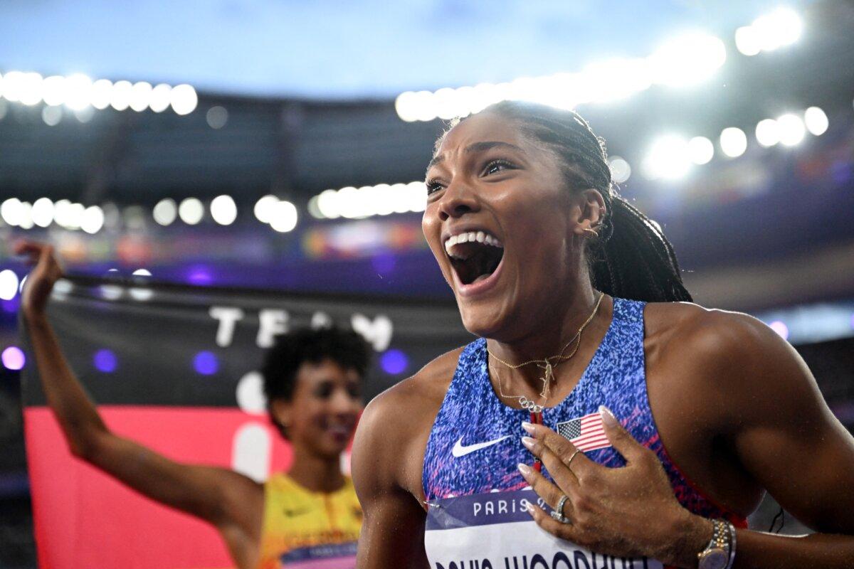 Gold medallist Tara Davis-Woodhall of Team United States celebrates after winning the women's long jump final of the athletics event at the Paris 2024 Olympic Games at Stade de France in Saint-Denis, north of Paris, on Aug. 8, 2024. (Kirill Kudryavtsev/AFP via Getty Images)