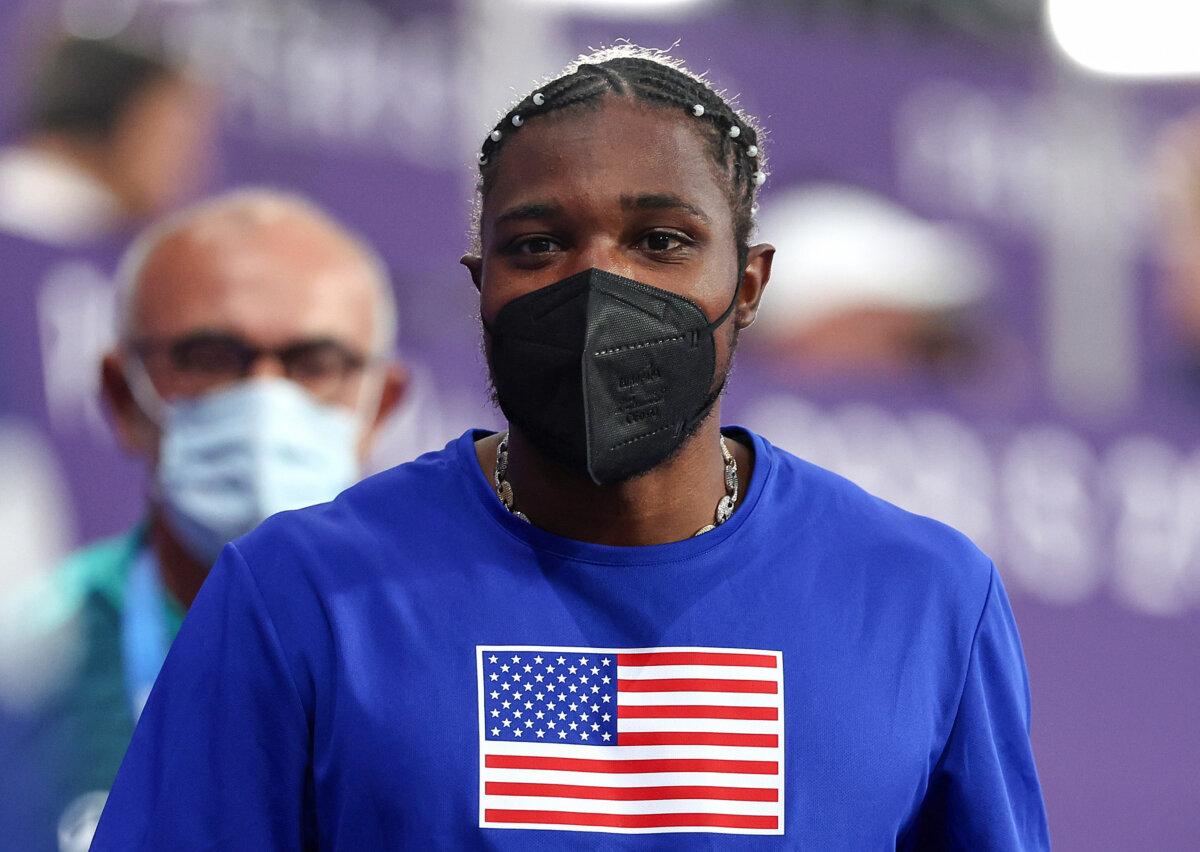 Bronze medalist Noah Lyles of Team United wears a mask after competing in the men's 200m final on day 13 of the Olympic Games at Stade de France in Paris on Aug. 8, 2024. (Hannah Peters/Getty Images)