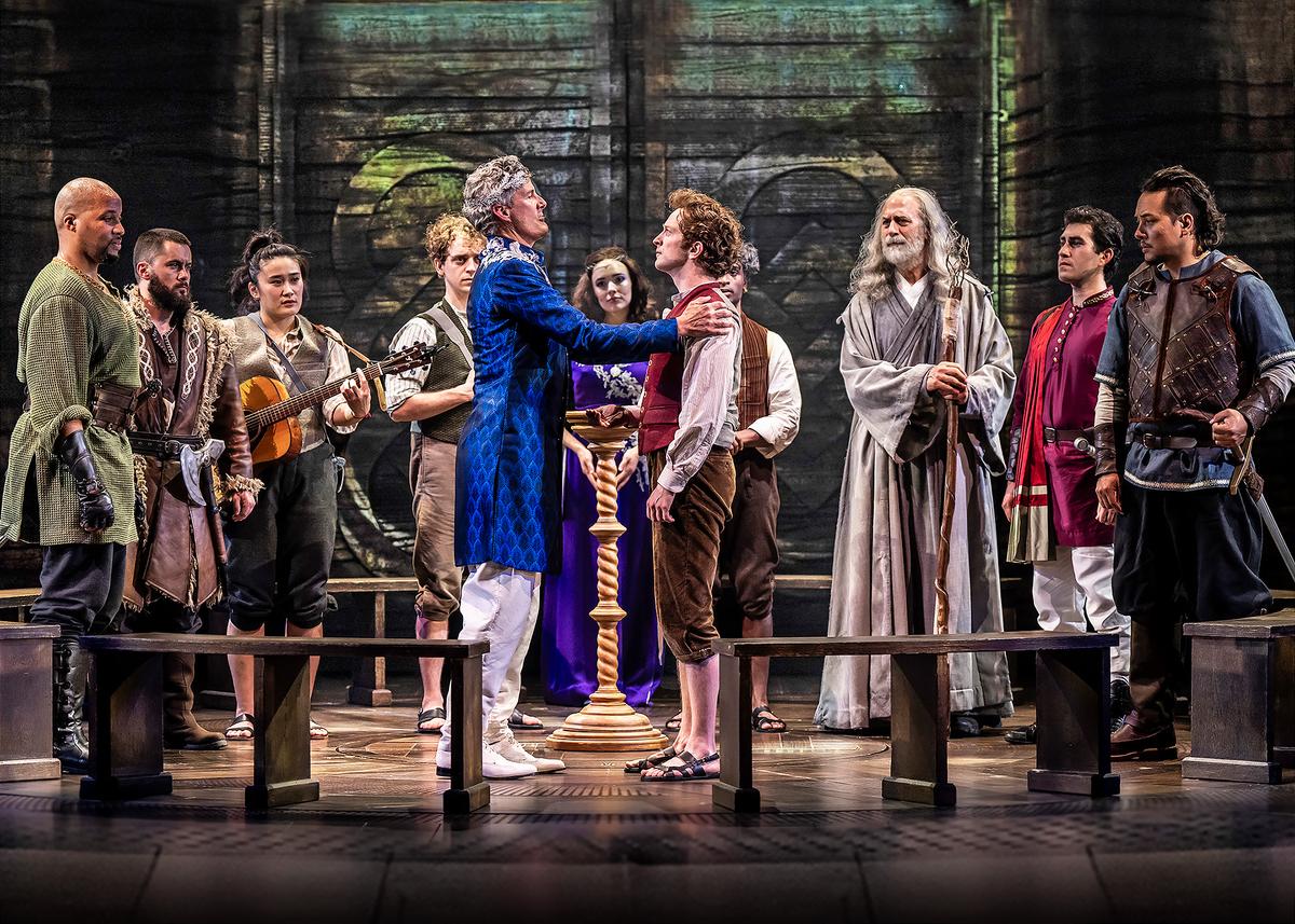 Frodo (Spencer Davis Milford, Right Center) surrounded by the ensemble, in "The Lord of the Rings - A Musical Tale." (Liz Lauren)