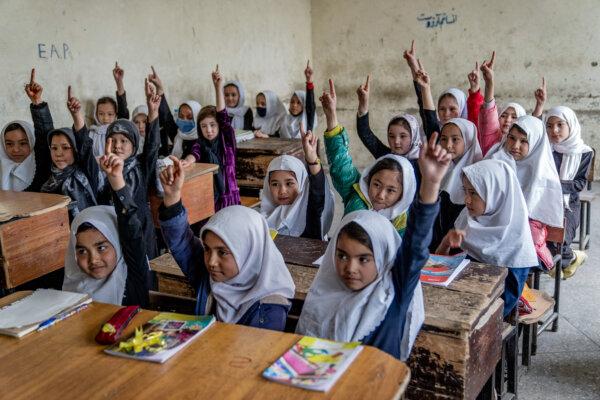 Afghan school girls attend their classroom on the first day of the new school year, in Kabul, on March 25, 2023. (Ebrahim Noroozi/AP)