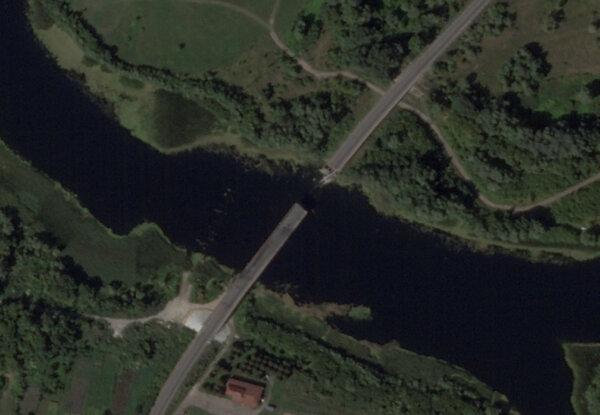 A satellite image shows a bridge collapsed over the Seym River in the Glushkovo district, following a Ukrainian strike in the Kursk region, Russia, on Aug. 17, 2024. (2024 Planet Labs Inc./Handout via Reuters)