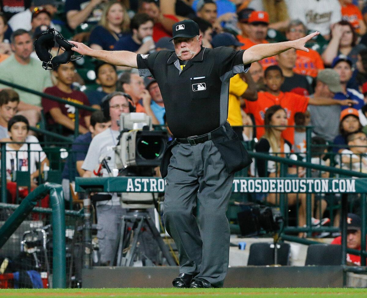 Home plate umpire Jim Joyce signals safe as the play under review was reversed in the fifth inning against the Houston Astros at Minute Maid Park in Houston, Texas, on Sept. 24, 2016. (Bob Levey/Getty Images)