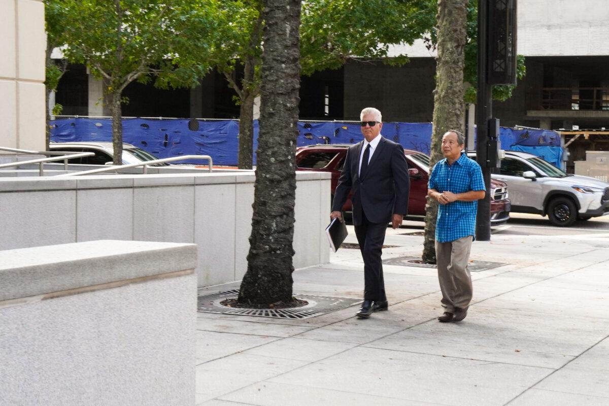 Ping Li and his lawyer Daniel Fernandez arrive at the U.S. District Court for the Middle District of Florida ahead of a court hearing in Tampa, Fla., on Aug. 23, 2024. (T.J. Muscaro/The Epoch Times)