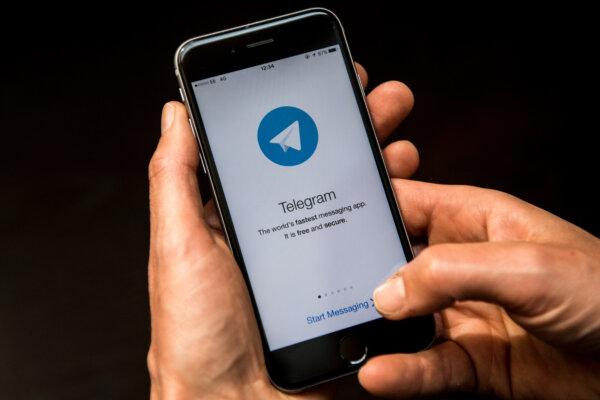 A person opens the Telegram messaging app on a smartphone in London on May 25, 2017. (Carl Court/Getty Images)
