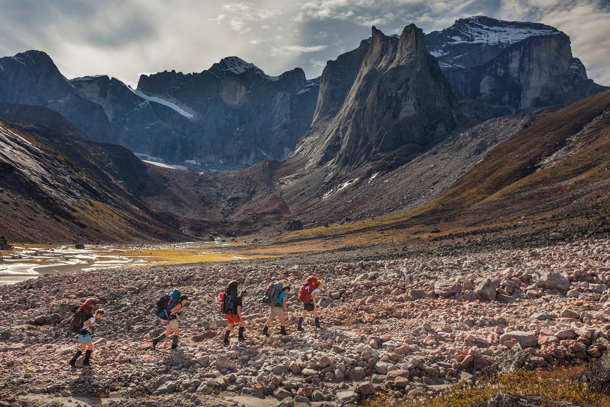 Backpackers trekking at the base of Arrigetch Peaks within Gates of the Arctic National Park. The rocky terrain was carved from the movement of glacial ice and water. (Patrick J. Endres/Getty Images)