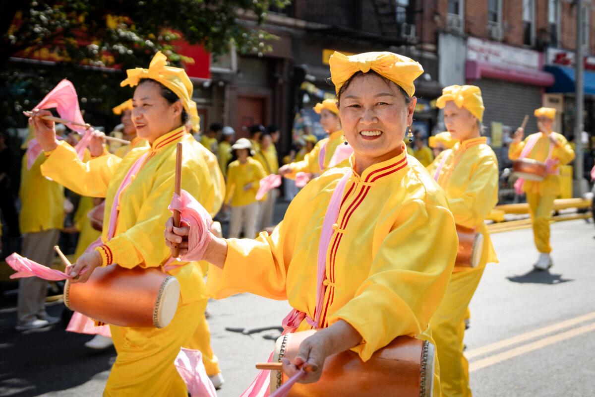 Falun Gong practitioners take part in a parade for the Chinese Mid Autumn Festival holiday in Brooklyn’s Chinatown neighborhood in New York City on Sept. 14, 2024. (Samira Bouaou/The Epoch Times)