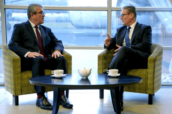 Prime Minister Sir Keir Starmer (right) speaks with Martin Hewitt (left) who has been appointed the head of the government's new Border Security Command, at an airfield near London, on Sept. 15, 2024. (Phil Noble/PA Wire)