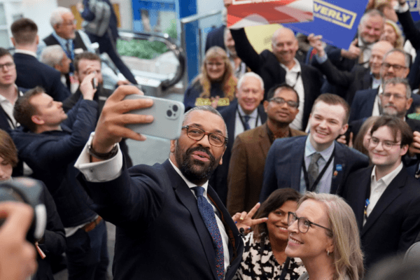 Leadership contender James Cleverly takes a selfie during the Conservative Party Conference at the International Convention Centre in Birmingham, England, on Sept. 30, 2024. (Stefan Rousseau/PA Wire)